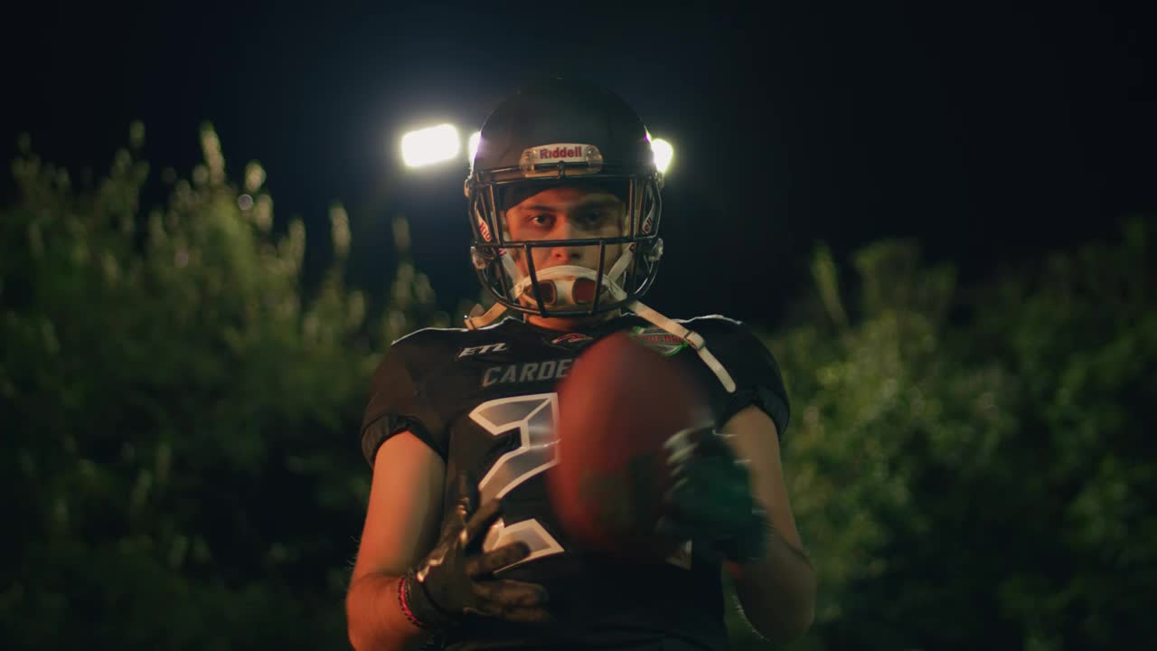 Stock Video Intimidating Football Player In Front Of The Camera Animated Wallpaper - Free Download
