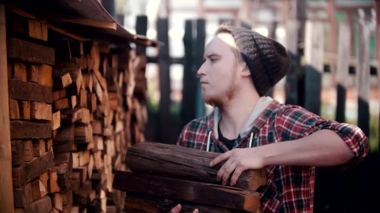 Free Stock Video Young Lumberjack Arranging Logs In A Pile Live Wallpaper - Free Download