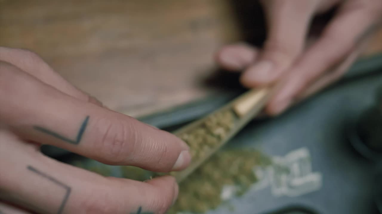 Video Stock Preparing A Marijuana Cigarette Live Wallpaper Free - Free Download