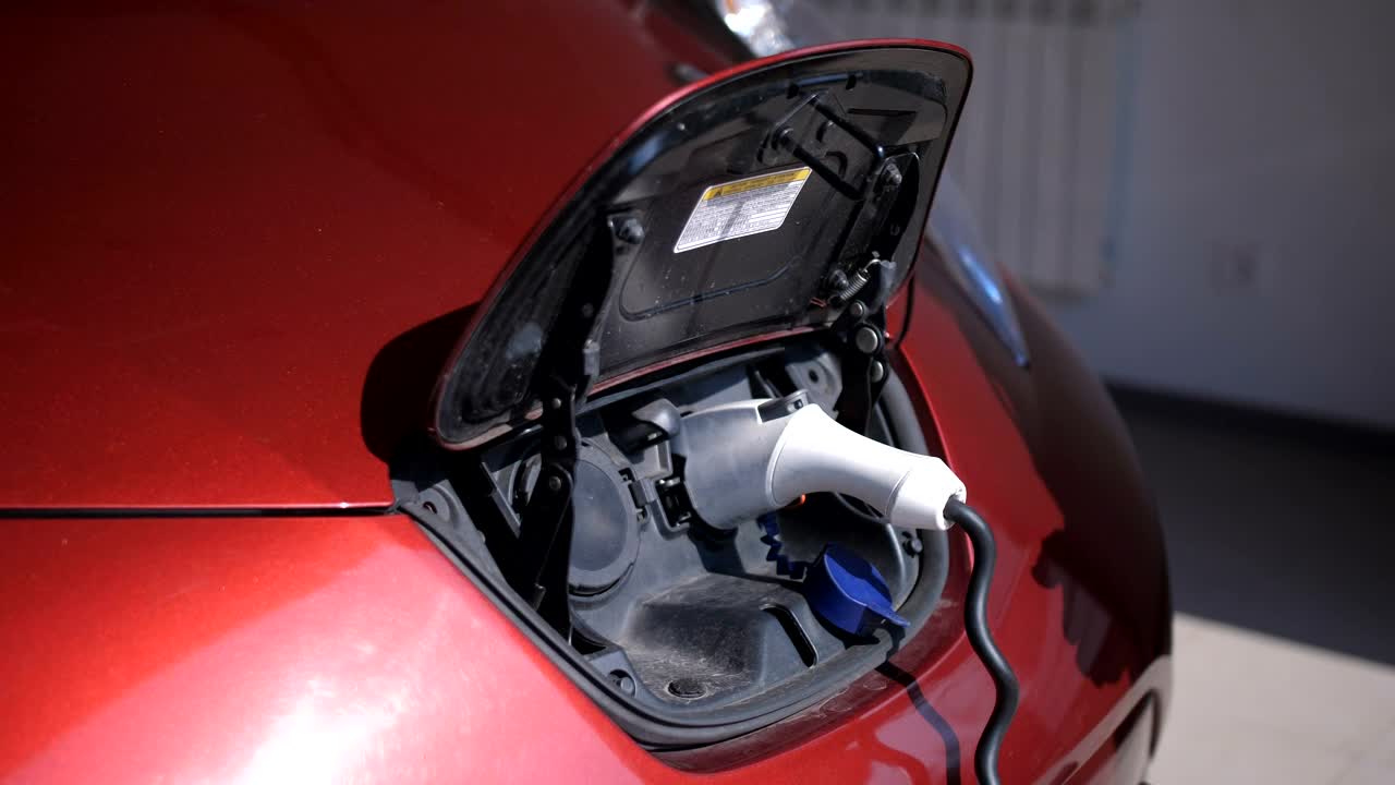 Stock Video Man Unplugging His Car From A Charging Ba Animated Wallpaper - Free Download