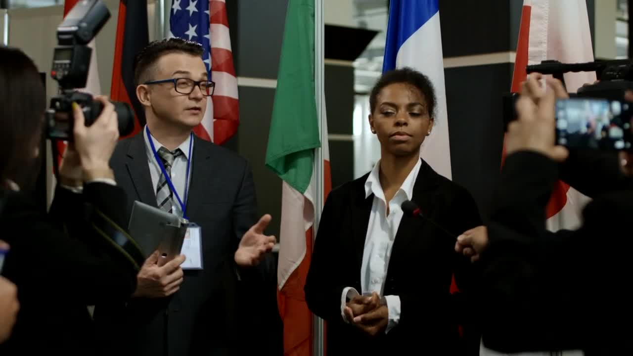 Stock Video Journalists Interviewing A Woman Animated Wallpaper - Free Download