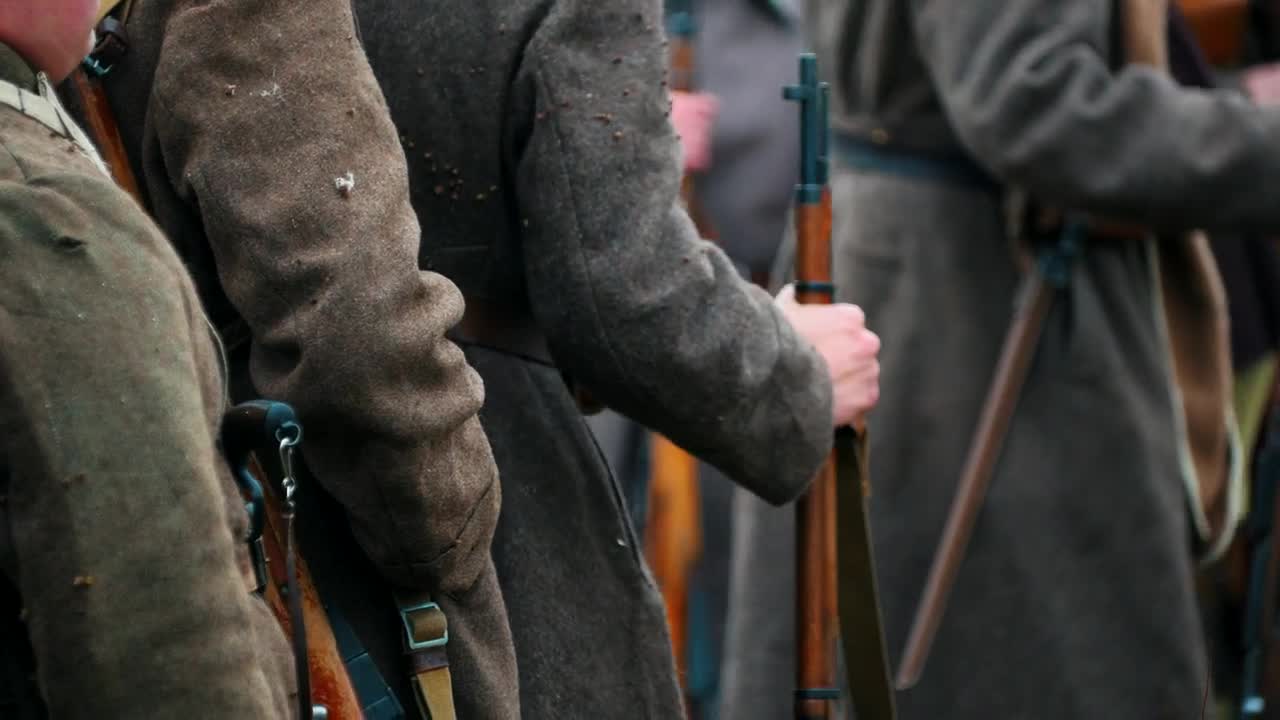 Free Video Stock Soldiers In Coats Standing In A Row Holding Guns Live Wallpaper - Free Download
