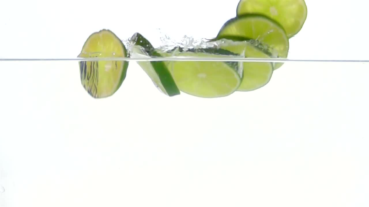 Stock Video Lime Slices Falling Through Water Animated Wallpaper - Free Download