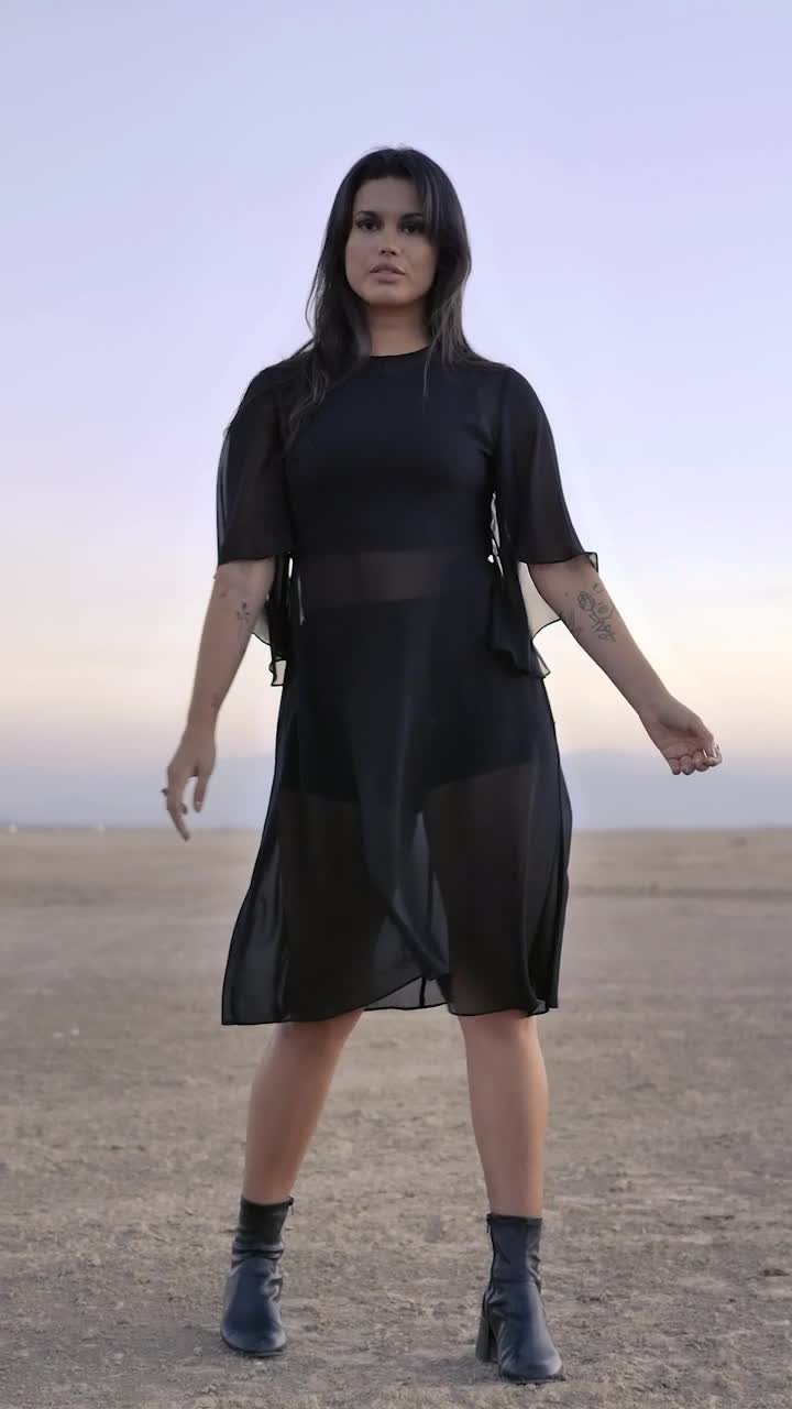 Free Stock Video Woman Posing For The Camera In The Middle Of A Live Wallpaper - Free Download