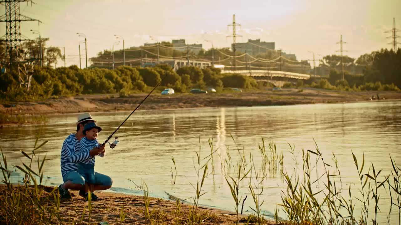 Stock Video Father And His Son Fishing On The Shore Of A Live Wallpaper For PC - Free Download