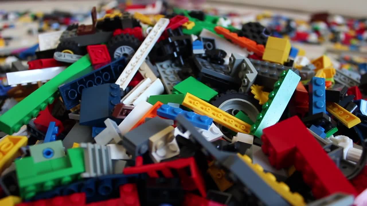 Free Stock Video Selecting Pieces Of Lego In A Pile Live Wallpaper - Free Download