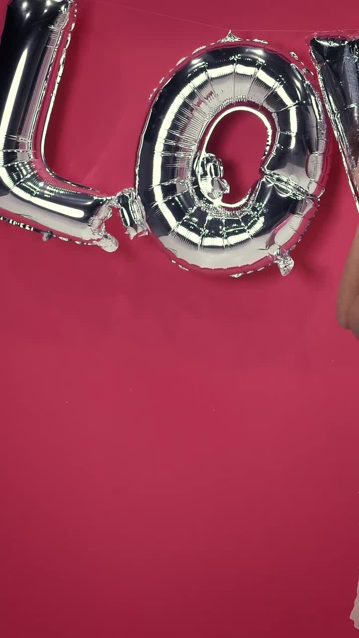 Free Video Stock Smiling And Charming Girl On A Red Background On Valentines Live Wallpaper - Free Download