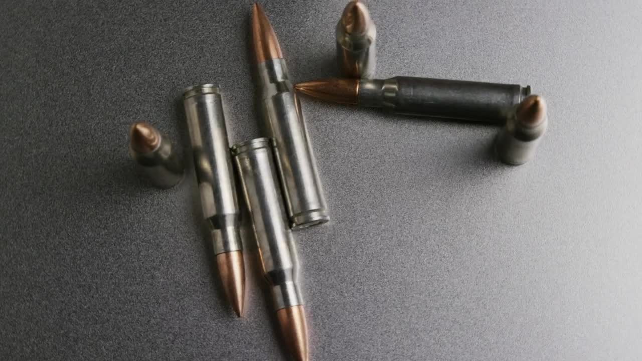 Free Video Stock top view of gun ammunition spinning Live Wallpaper - Free Download