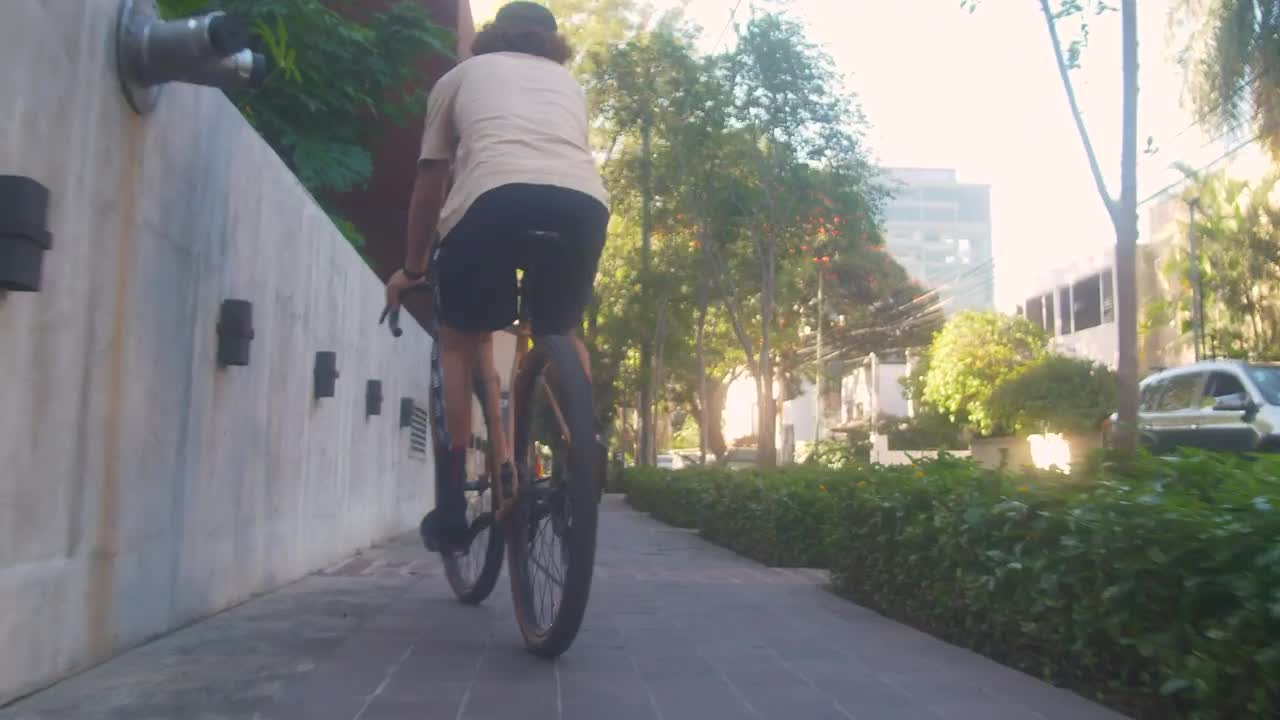 Stock Video Cyclist Zigzagging Down The Sidewalk On The Street Live Wallpaper For PC - Free Download