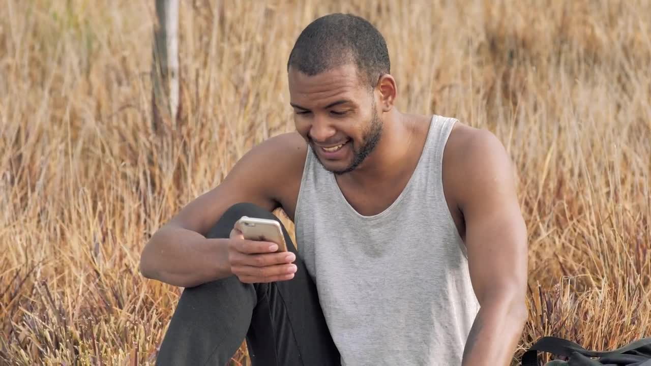 Stock Video Man Checks His Smartphone After Training Animated Wallpaper - Free Download