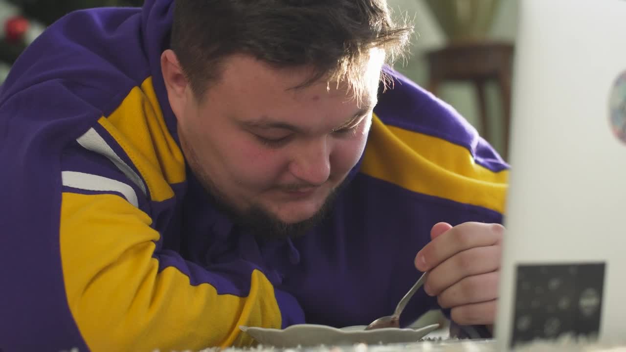 Stock Video Obese Man Eats Cereal In Front Of Computer Screen Live Wallpaper - Free Download