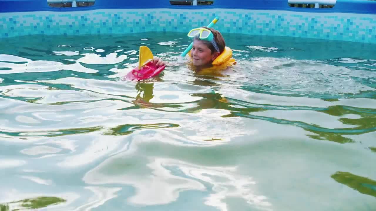 Stock Video Little Boy Swimming In A Pool With A Toy Boat Animated Wallpaper - Free Download