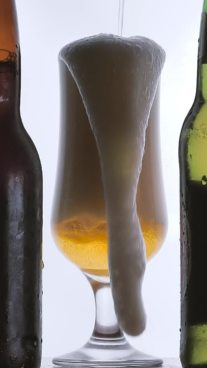 Stock Video Beer Foam Spilling Into A Glass On White Background Live Wallpaper For PC - Free Download