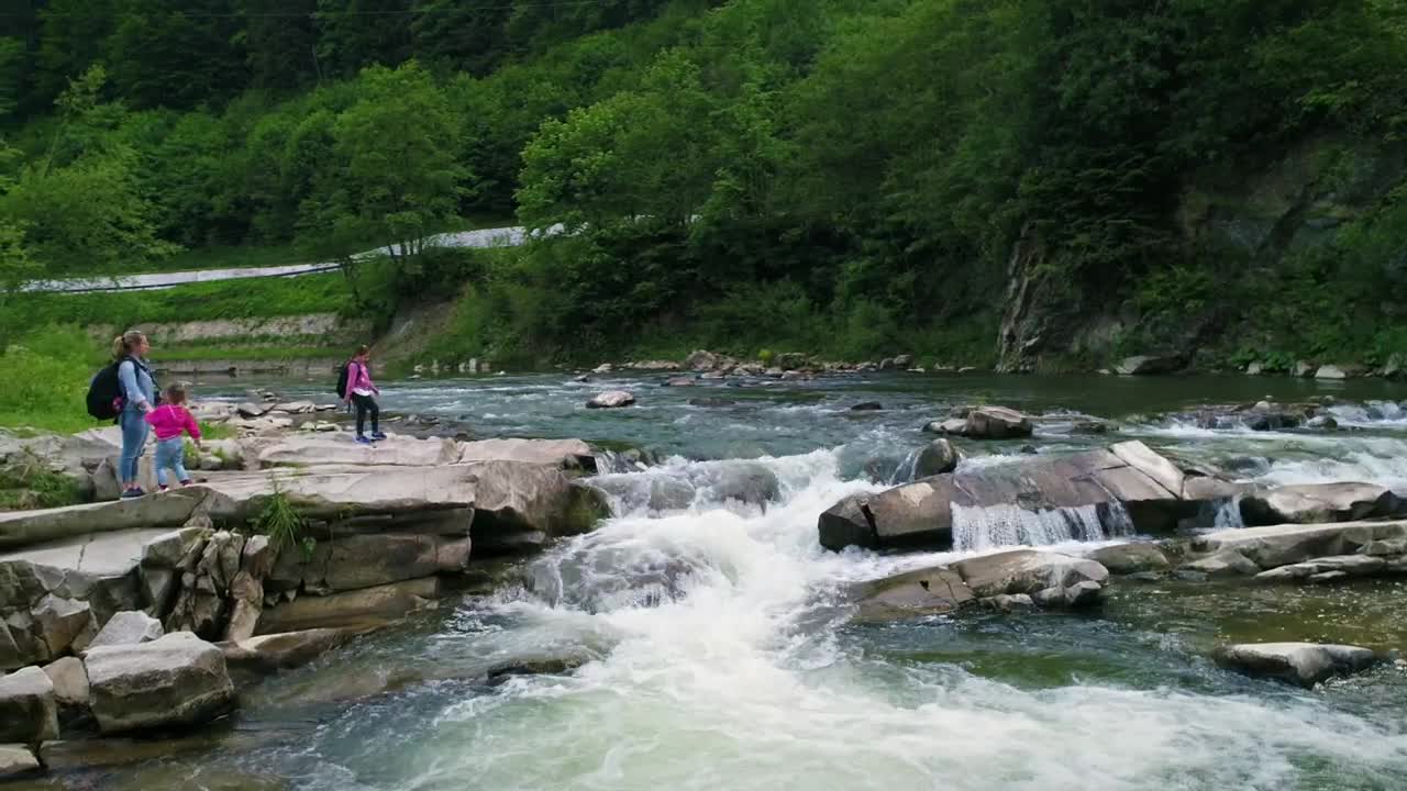 Stock Video Mother And Daughters Next To A River In The Fores Animated Wallpaper - Free Download