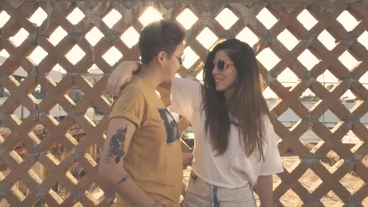 Stock Video Couple Caressing In Front Of Fence Live Wallpaper For PC - Free Download