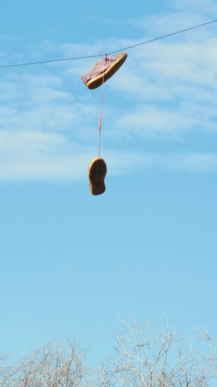 Stock Video Old Shoes Hanging On An Electric Wire Live Wallpaper - Free Download