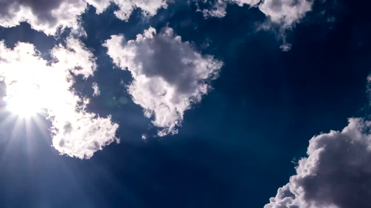 Stock Video Lens Flare Through White Clouds Animated Wallpaper - Free Download