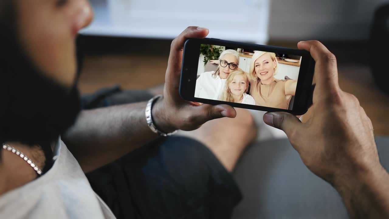 Stock Video Man Smiles At Facebook Video Call From Famil Animated Wallpaper - Free Download