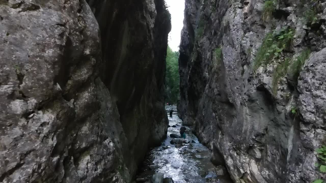 Stock Video Explorers Crossing A River Between Two Mountains Live Wallpaper For PC - Free Download