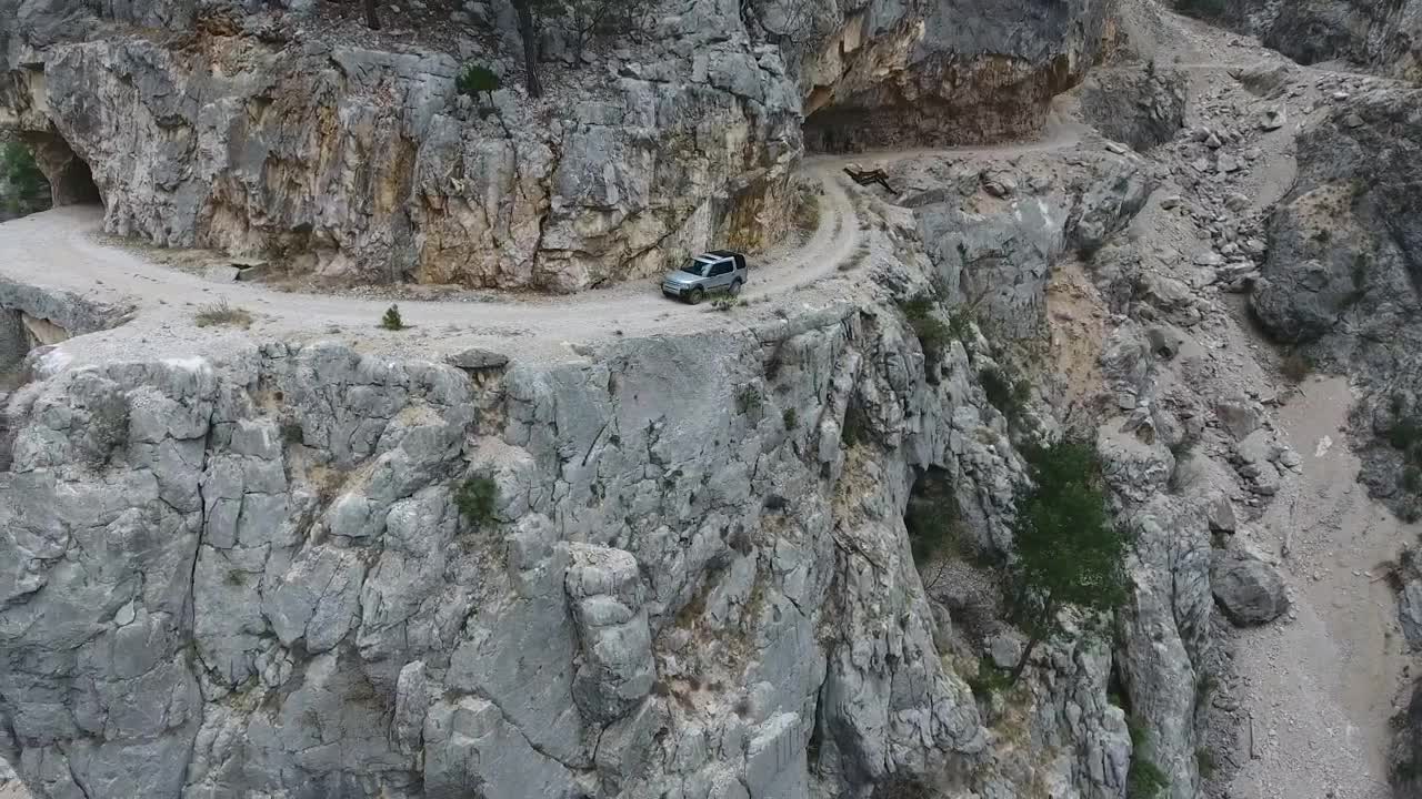 Stock Footage Vehicle Driving Through The Rocky Mountain Road Live Wallpaper - Free Download