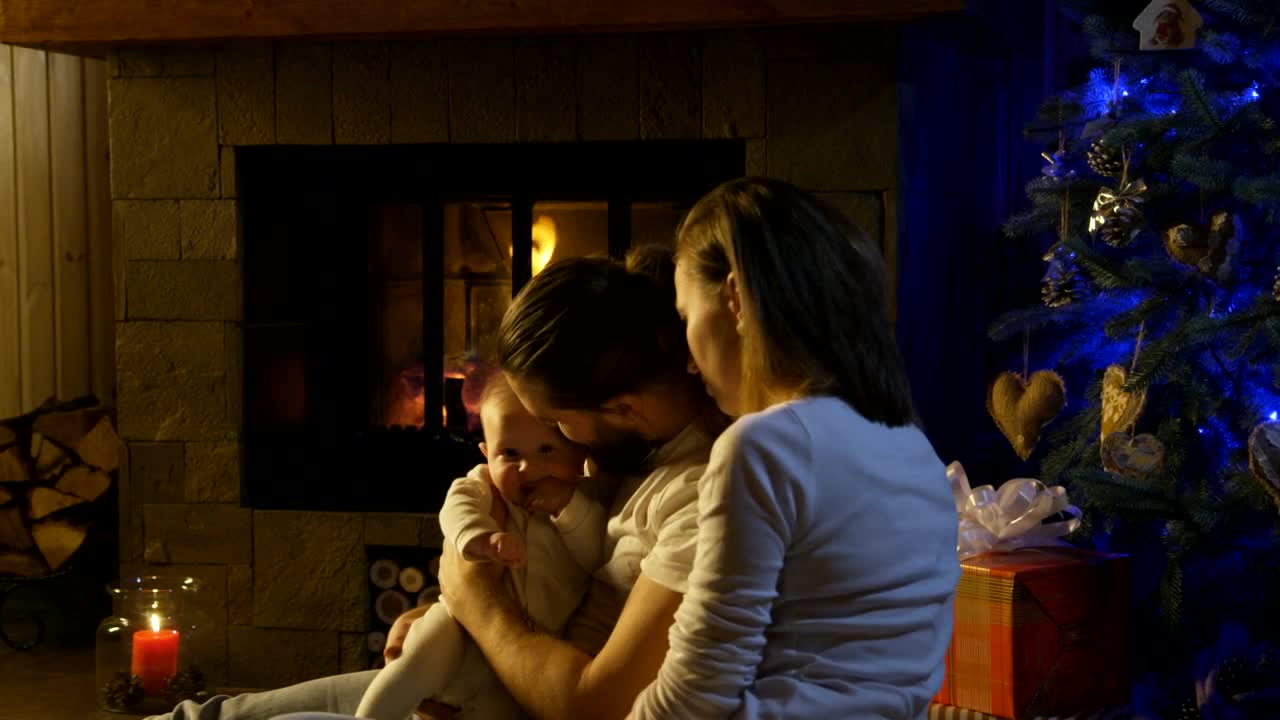 Stock Video Couple And Baby Near The Fireplace Live Wallpaper For PC - Free Download