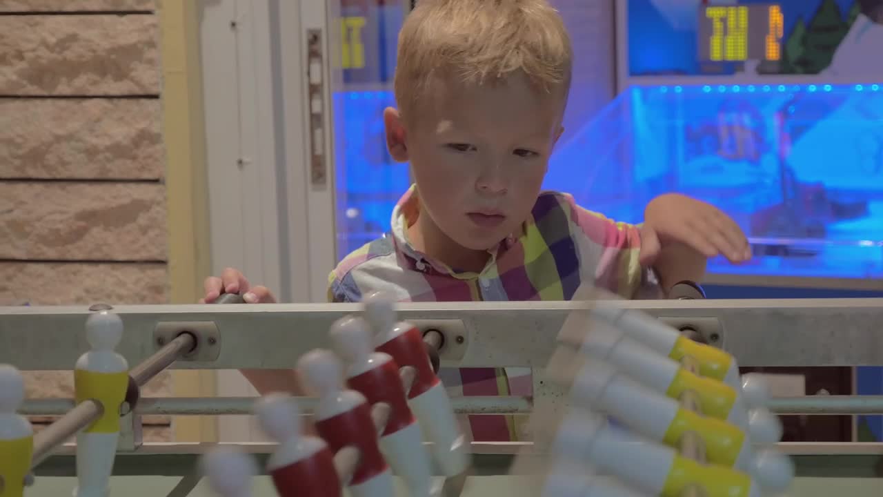 Video Stock Child Watching A Game Of Table Football Live Wallpaper For PC - Free Download