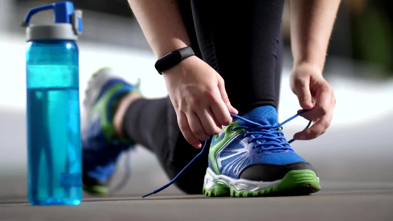 Stock Video Person In Sportswear Tying His Shoelaces Live Wallpaper - Free Download