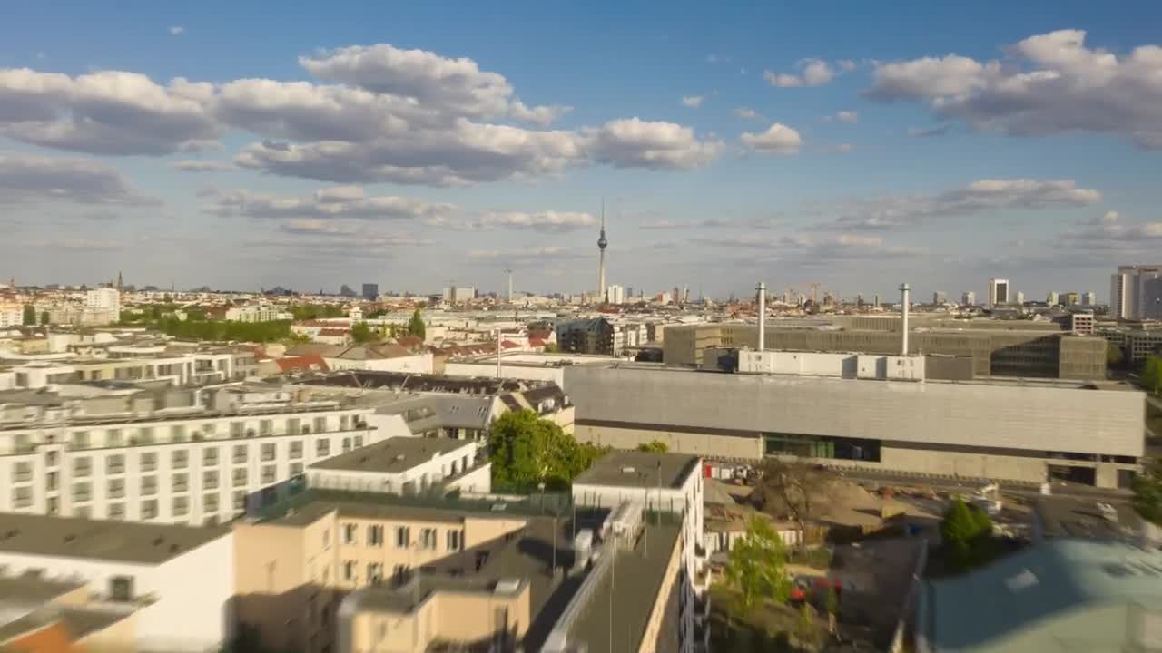 Stock Video Low Flight Over The Rooftops Of Berlins Buildings Animated Wallpaper - Free Download
