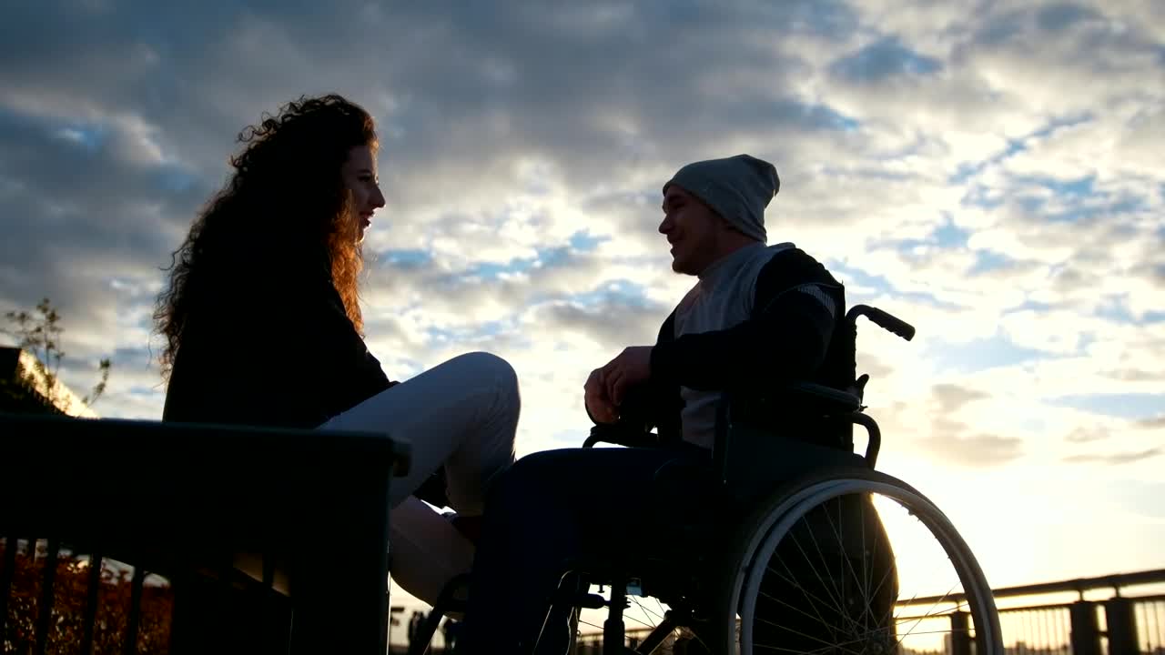 Stock Video Man On A Wheelchair Talking To A Young Woman I Animated Wallpaper - Free Download