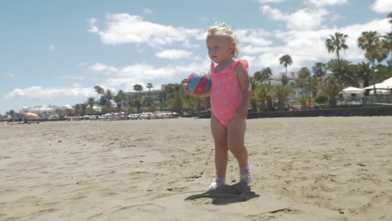 Free Video Stock toddler holding a small ball Live Wallpaper - Free Download
