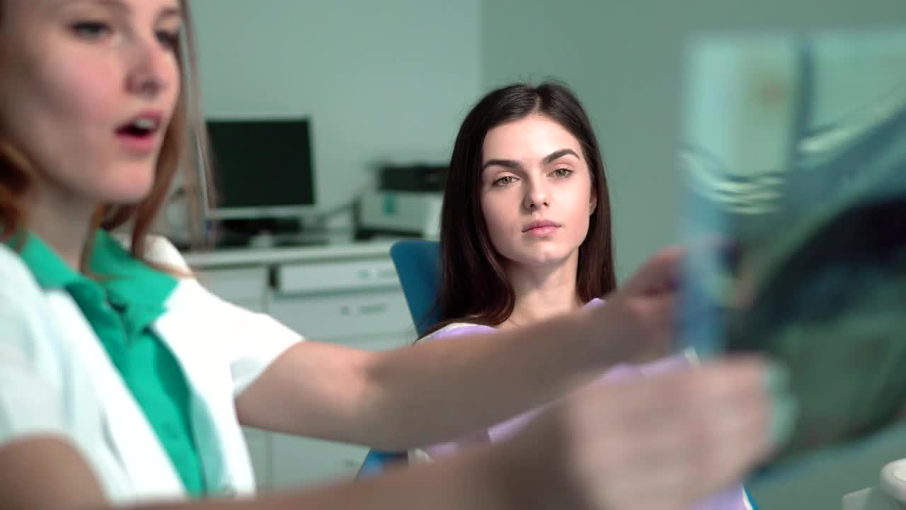 Stock Video Nurse Shows Patient X Ray In Hospital Room Live Wallpaper - Free Download