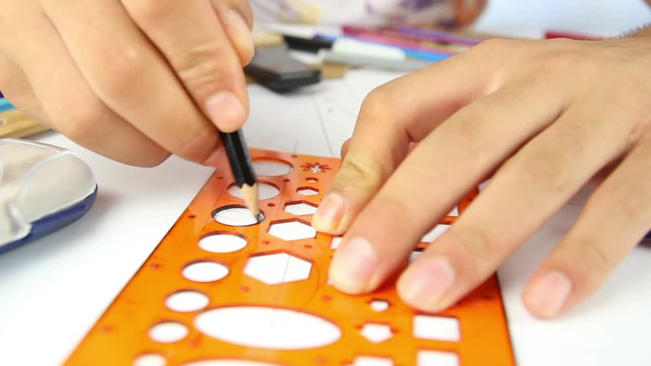 Stock Video Hands Of A Person Drawing Circles With A Template Animated Wallpaper - Free Download