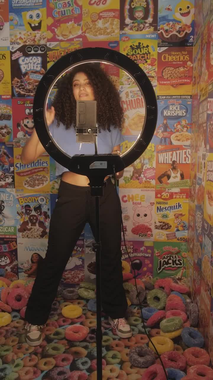 Stock Video Girl Recording A Video On A Background Of Cereal Boxes Live Wallpaper For PC - Free Download