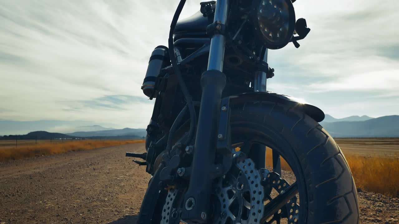 Stock Video Motorcyclist Riding A Motorcycle Parked In A Desert Live Wallpaper - Free Download