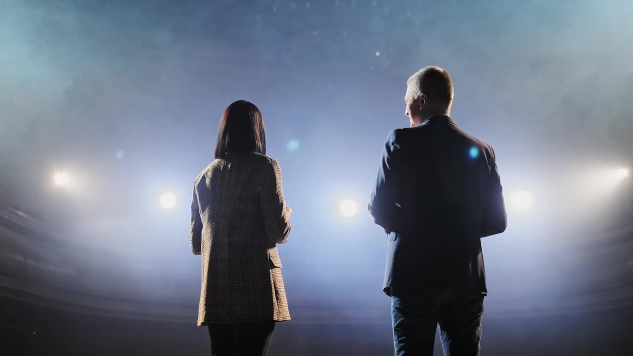 Free Stock Video Two Presenters Speaking Towards The Audience Live Wallpaper - Free Download