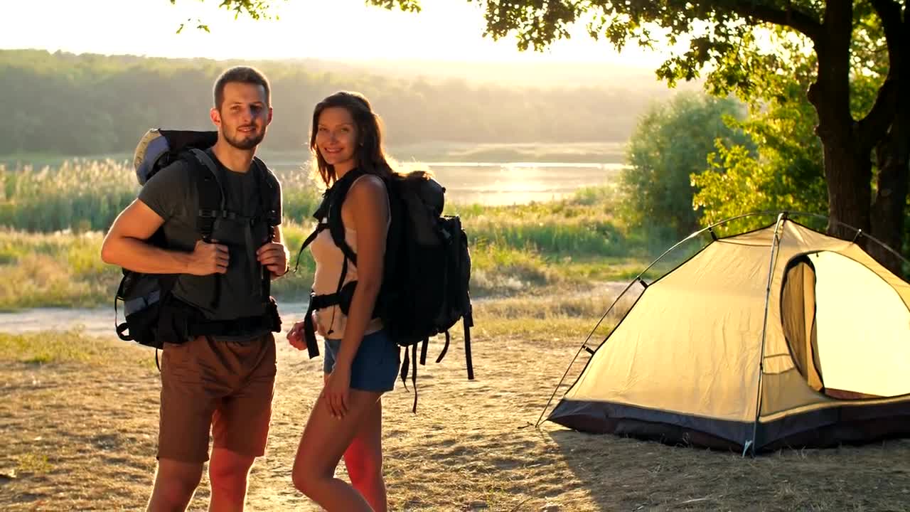 Stock Video Happy Camping Couple Watching Together At Camera Animated Wallpaper - Free Download