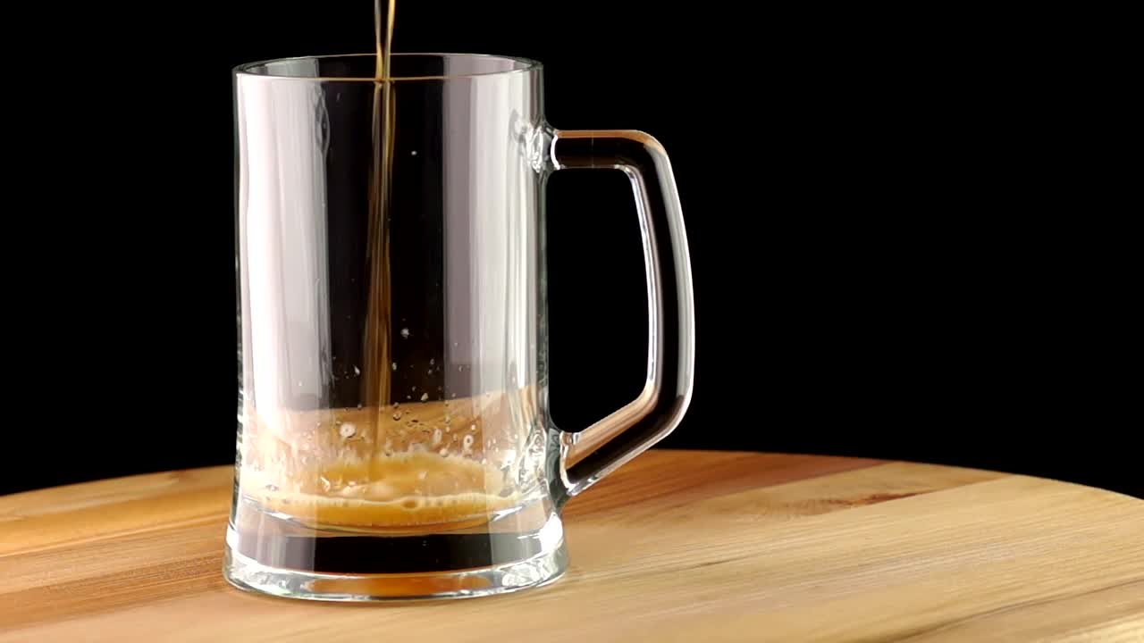 Stock Video Dark Beer Poured Into A Transparent Mug Live Wallpaper For PC - Free Download
