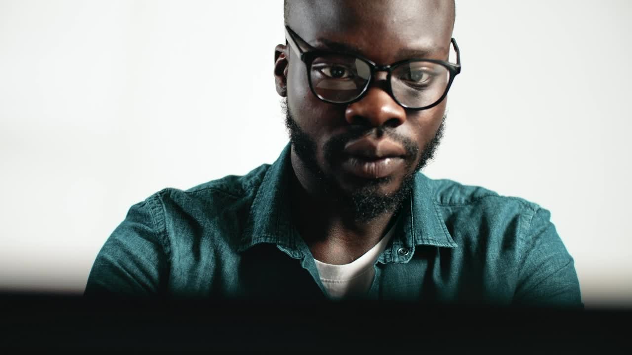Stock Video Man Thinks And Takes Off Glasses While Workin Animated Wallpaper - Free Download