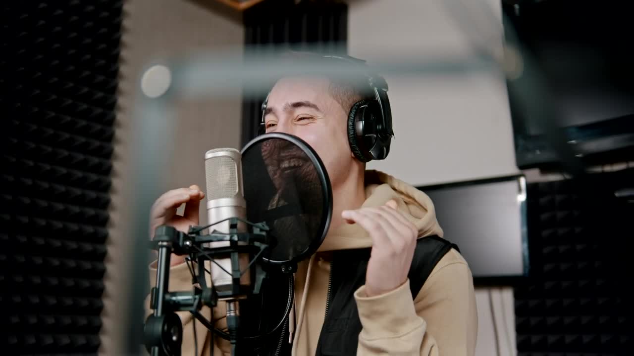 Stock Video Man Singing Into A Microphone In An Audio Boot Animated Wallpaper - Free Download