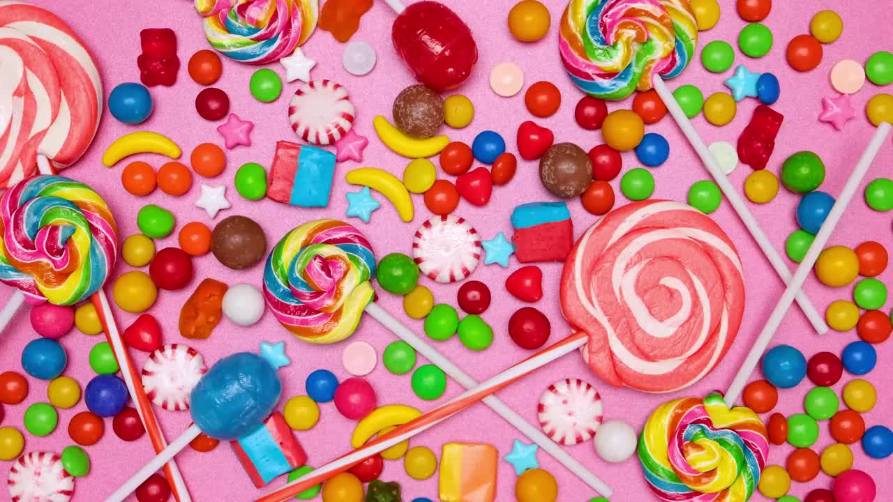 Stock Video Covering A Pink Background With Candies In Stop Motion Live Wallpaper For PC - Free Download