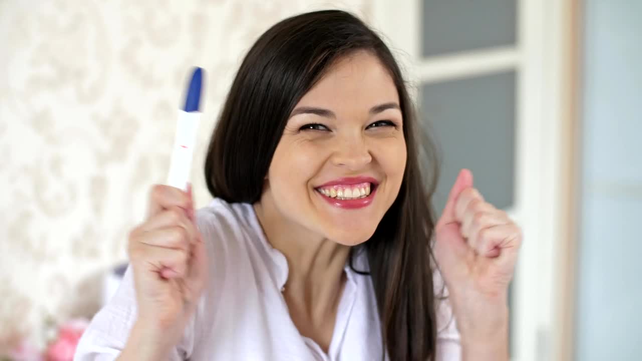 Free Stock Video Young Happy And Excited Woman With A Pregnancy Test Live Wallpaper - Free Download