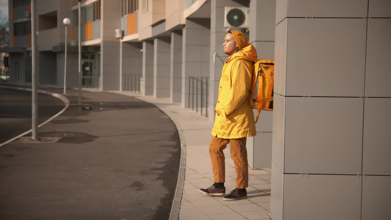 Stock Video Courier Man With Backpack Searching For Delivery Address Live Wallpaper For PC - Free Download