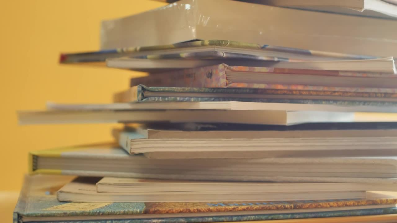 Stock Video Detailed View Of A Disarranged Tower Of Books Live Wallpaper For PC - Free Download