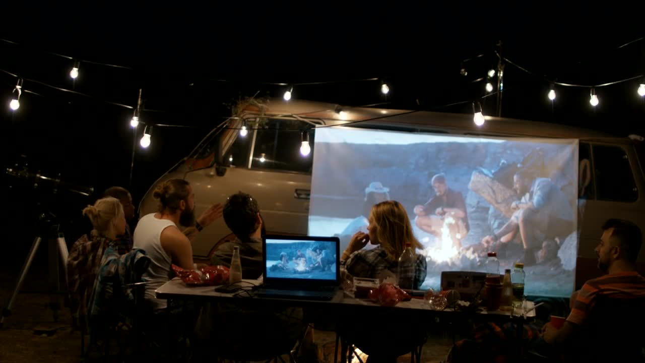 Stock Video Friends Camping Watching A Film On A Projector Live Wallpaper For PC - Free Download