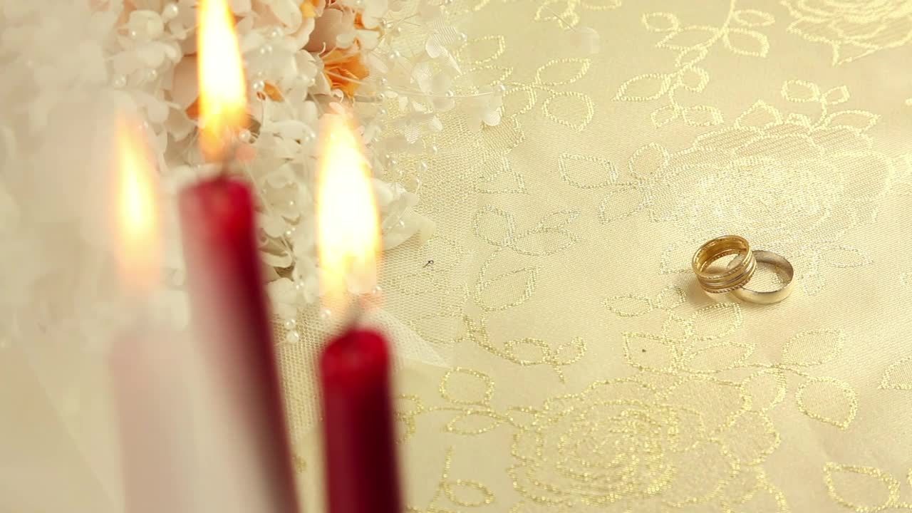 Stock Video Pair Of Rings Beside Plastic Flowers And Candles Live Wallpaper - Free Download