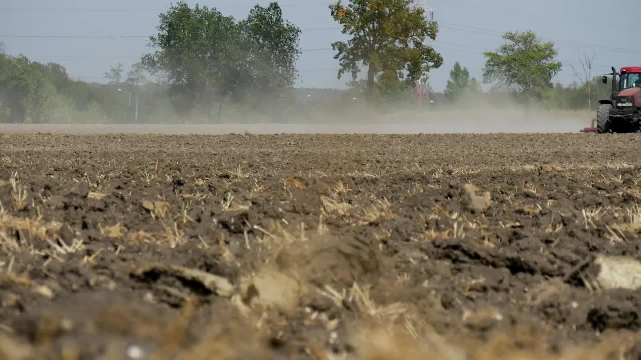 Free Video Stock tractor passing over a dirt field Live Wallpaper - Free Download