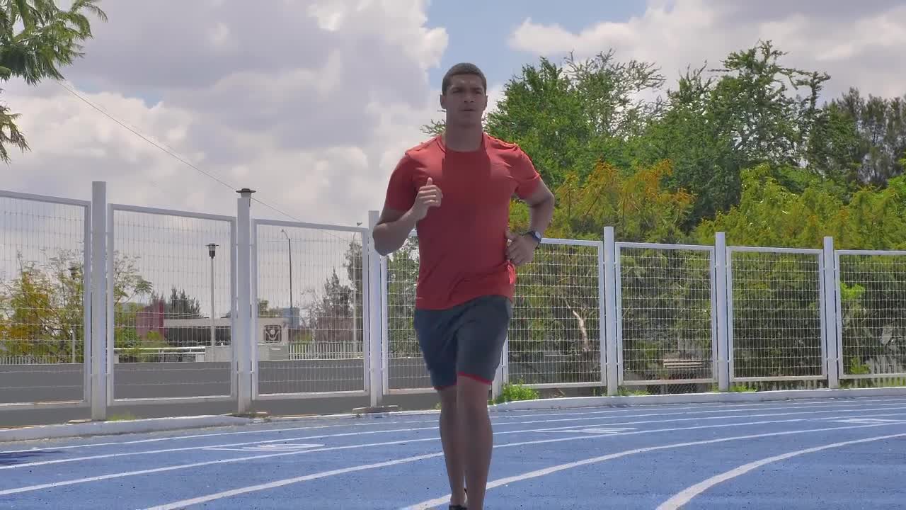Stock Video Man Jogging On A Running Track On A Sunny Da Animated Wallpaper - Free Download