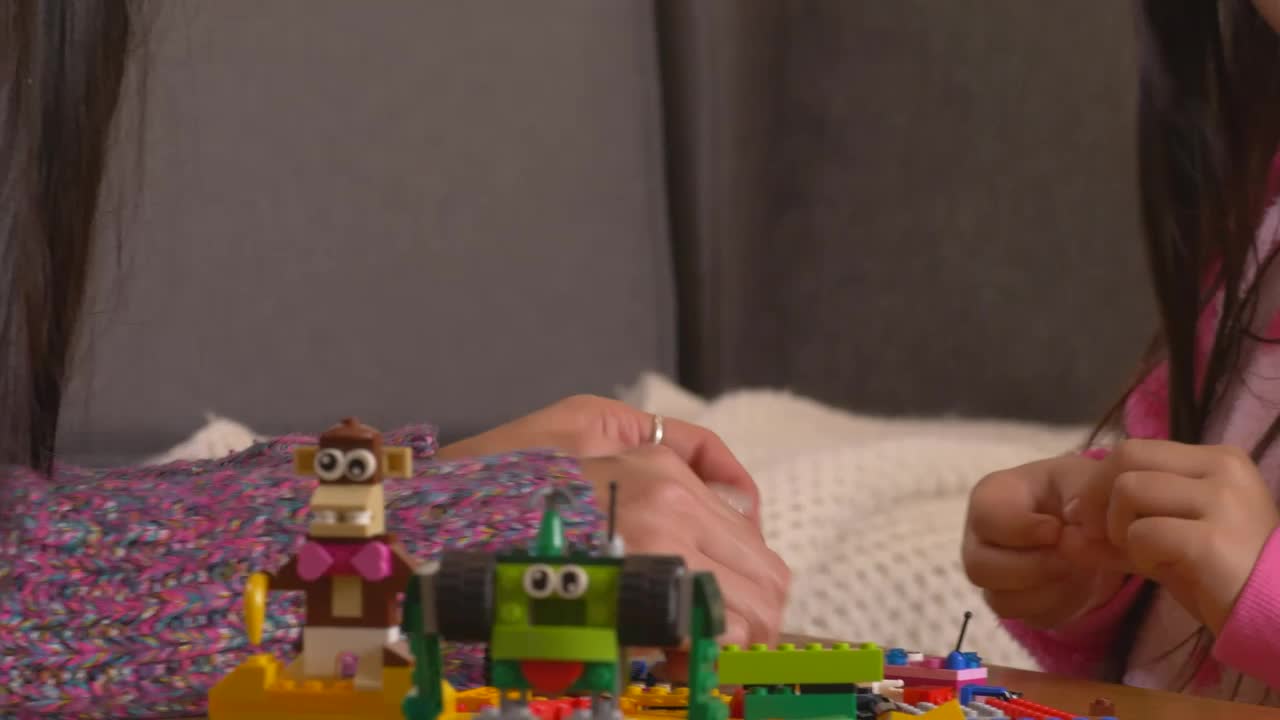 Stock Video Mother Playing With Her Daughter With Lego Piece Animated Wallpaper - Free Download