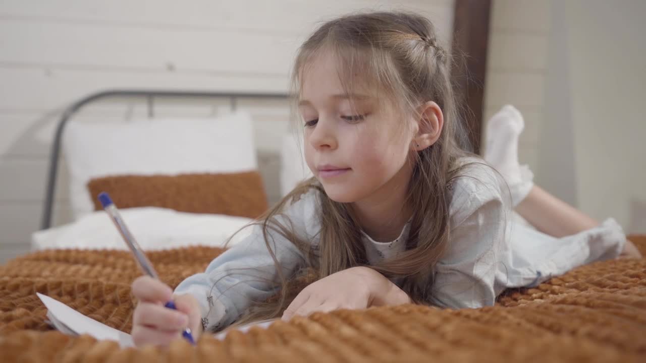 Stock Video Little Girl Enjoys Drawing Hobby On Bed Animated Wallpaper - Free Download