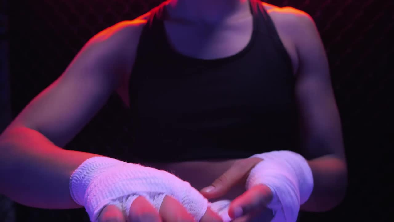 Stock Video Girl Putting A Bandage On Her Hands Before A Fight Live Wallpaper For PC - Free Download